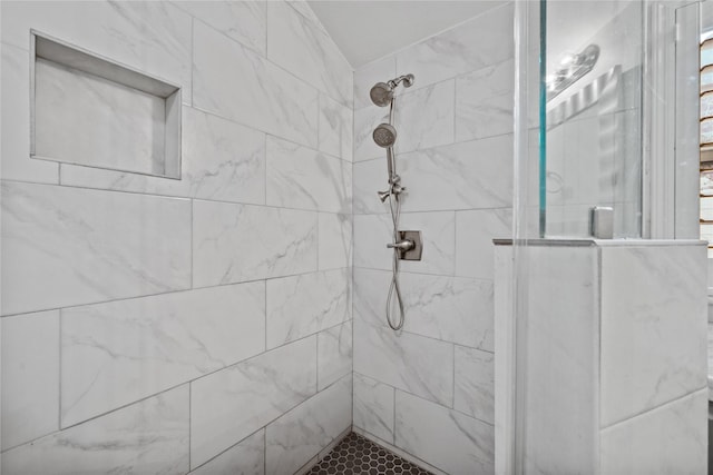 full bathroom with tiled shower