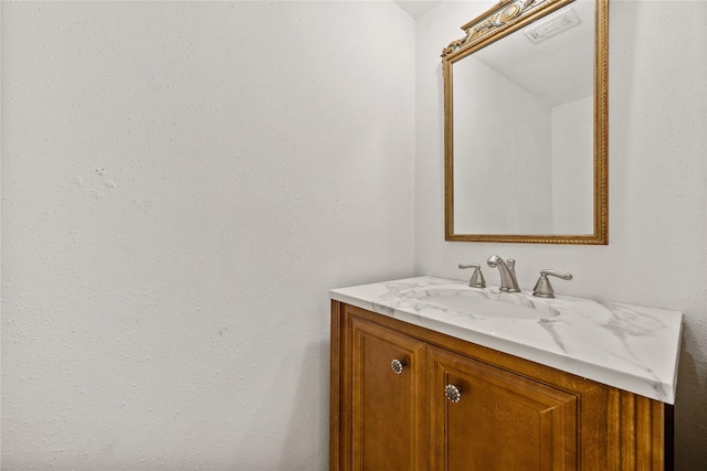 bathroom featuring vanity and visible vents