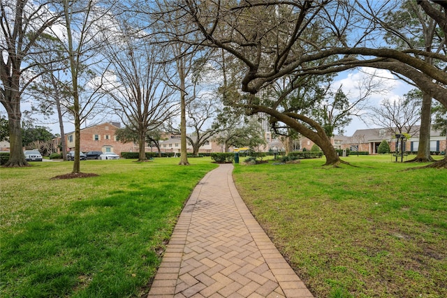 surrounding community featuring a residential view and a yard