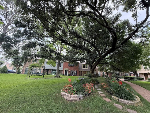 5874 Doliver Dr Unit 121, Houston, TX 77057 - view of property's community with a lawn