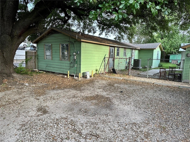 view of front facade with central AC and fence