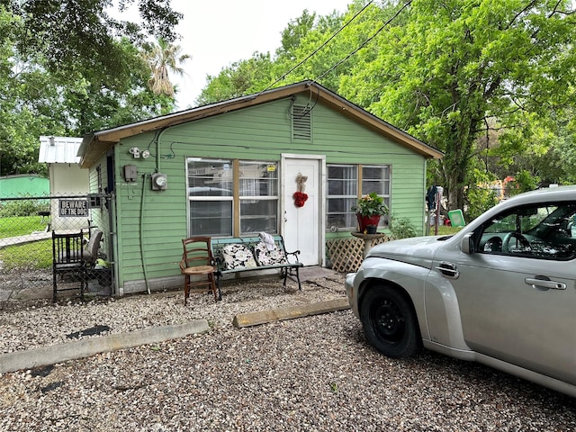 view of front of home with fence