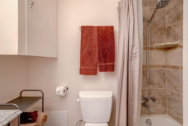 full bathroom featuring vanity, shower / bath combination with curtain, and toilet