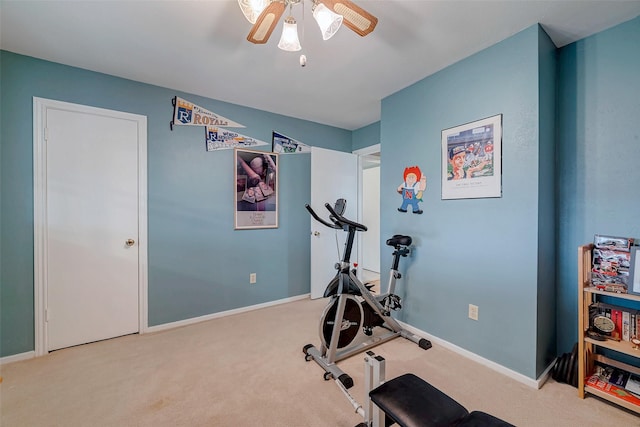 workout room featuring carpet floors, ceiling fan, and baseboards