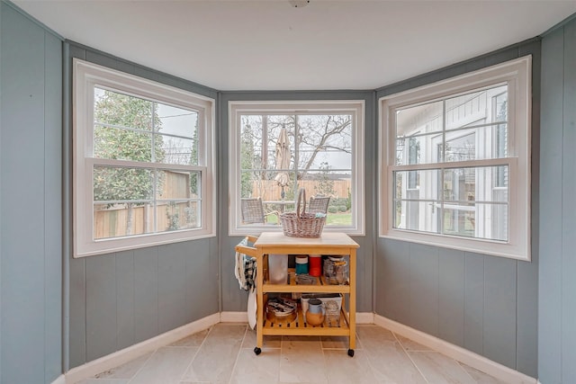 dining area featuring baseboards and light tile patterned floors