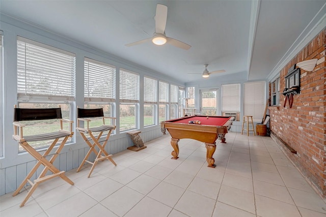 game room with light tile patterned floors, brick wall, pool table, and ornamental molding