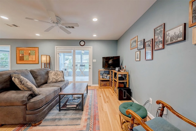 living area featuring baseboards, recessed lighting, visible vents, and light wood-style floors