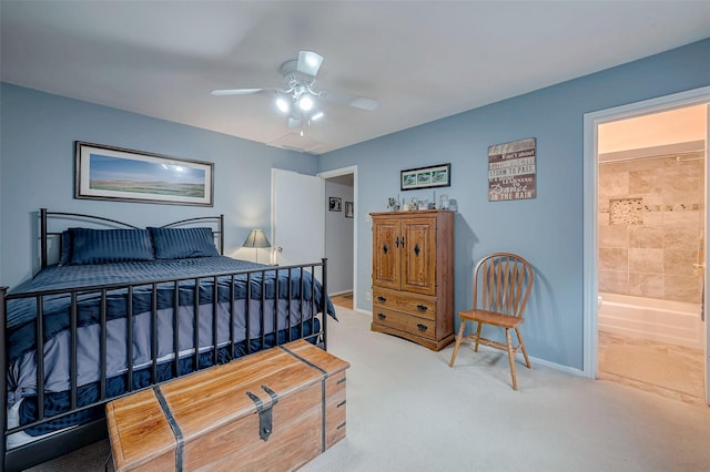 carpeted bedroom with ceiling fan, connected bathroom, and baseboards