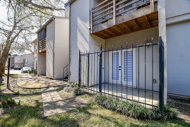 view of property exterior featuring french doors