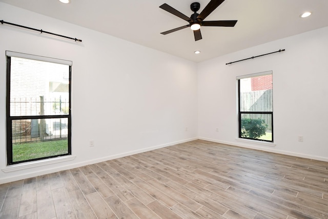 unfurnished room featuring light wood-style floors, recessed lighting, baseboards, and a ceiling fan