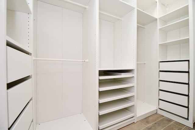 spacious closet featuring wood finished floors