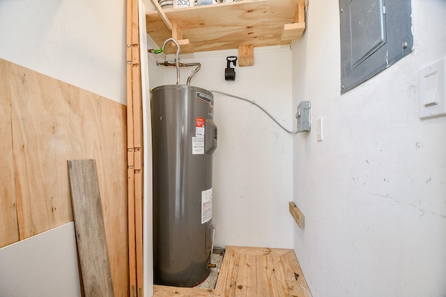 utility room featuring electric water heater and electric panel