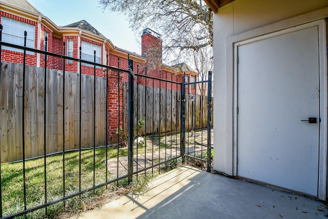 view of gate with fence