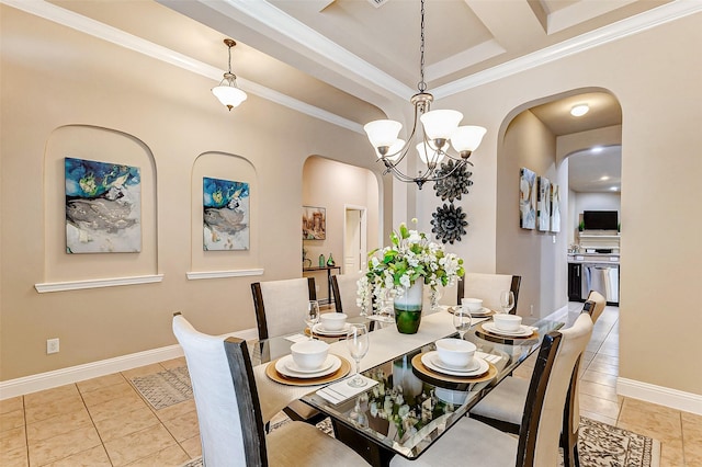 dining space with light tile patterned floors, baseboards, arched walkways, and ornamental molding