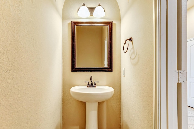 bathroom with a textured wall