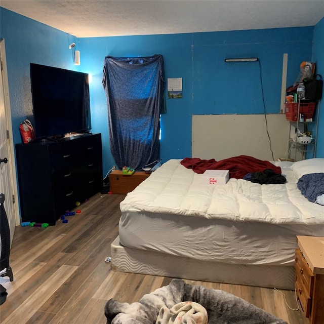 bedroom featuring wood finished floors