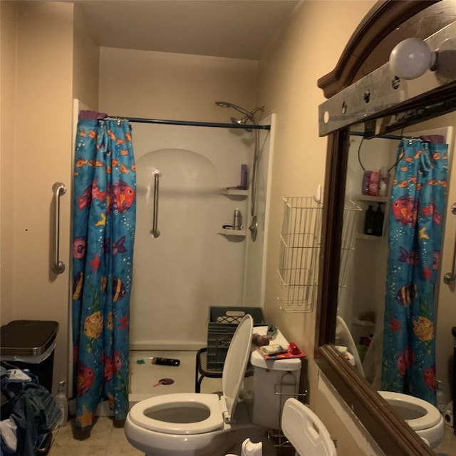 full bath featuring tile patterned flooring, a shower stall, and toilet