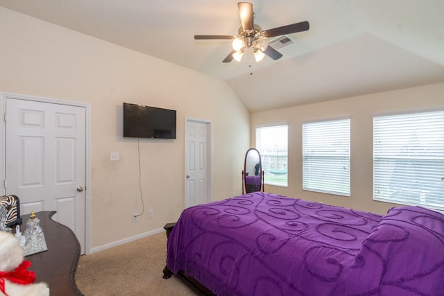 bedroom featuring ceiling fan, light carpet, visible vents, baseboards, and vaulted ceiling