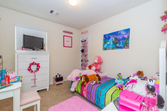 bedroom featuring baseboards, visible vents, and light colored carpet