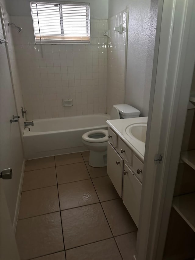 bathroom featuring shower / bathing tub combination, vanity, toilet, and tile patterned floors