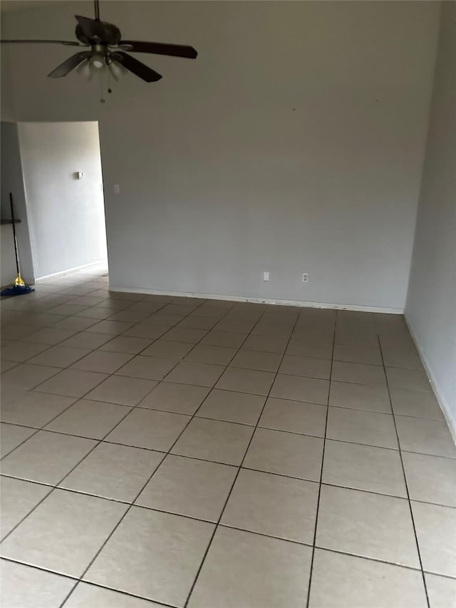 empty room featuring light tile patterned floors and a ceiling fan