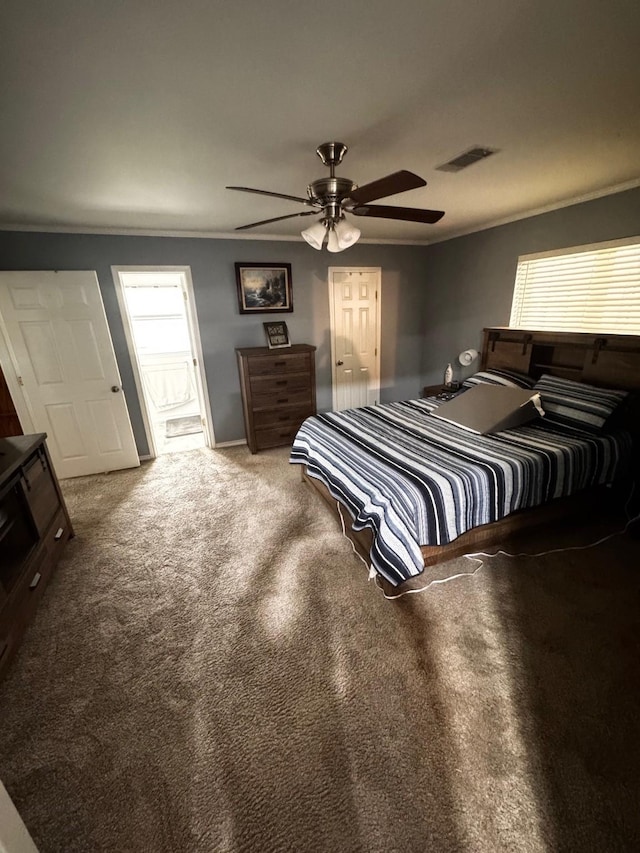 bedroom featuring a ceiling fan, carpet, visible vents, and crown molding