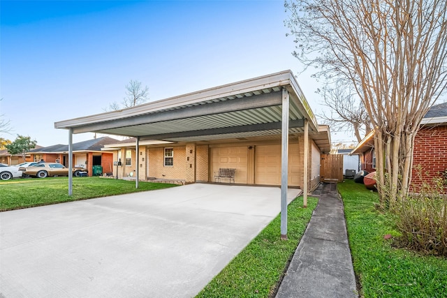 view of front of property featuring concrete driveway, brick siding, a front lawn, and an attached garage