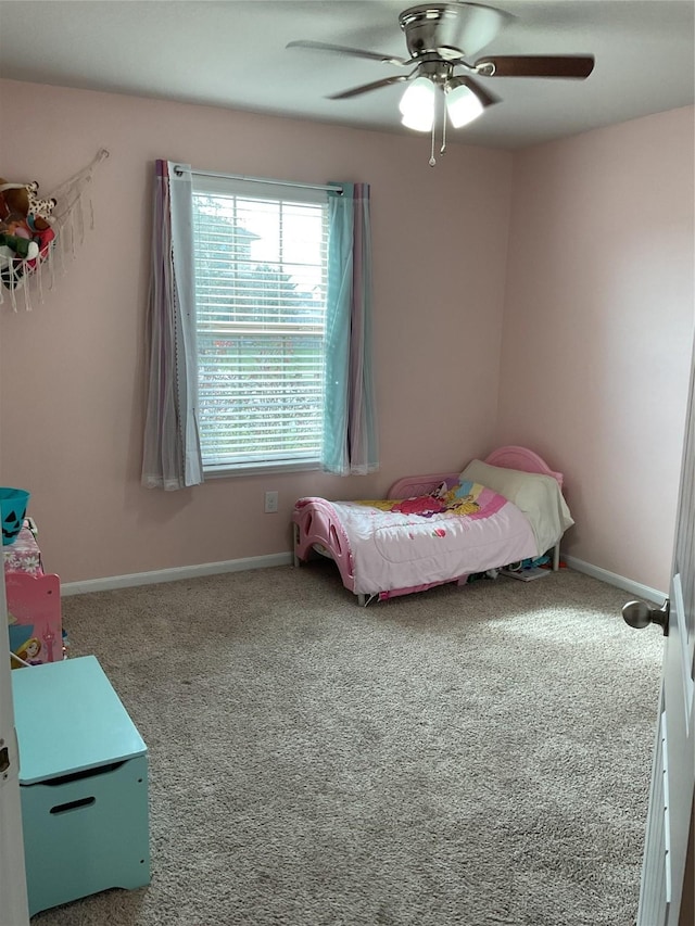 bedroom with carpet flooring, ceiling fan, and baseboards