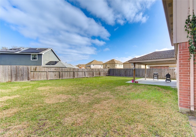 view of yard featuring a patio area and a fenced backyard