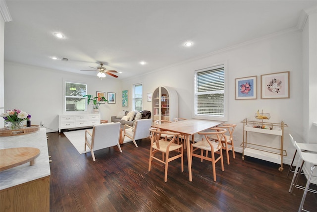 dining area with arched walkways, crown molding, recessed lighting, visible vents, and dark wood-type flooring