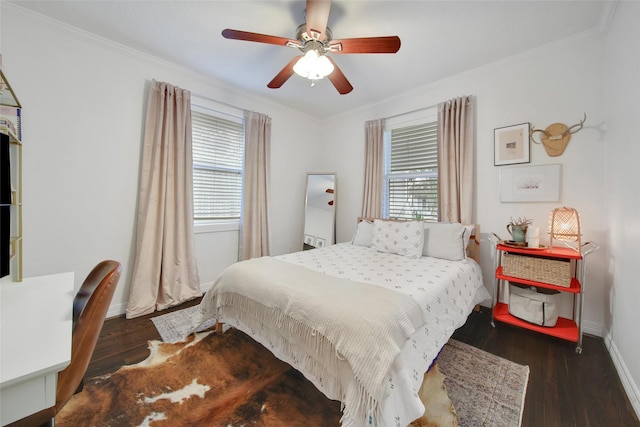 bedroom featuring multiple windows, ornamental molding, and dark wood-style flooring