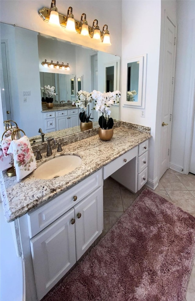 bathroom featuring tile patterned flooring and vanity