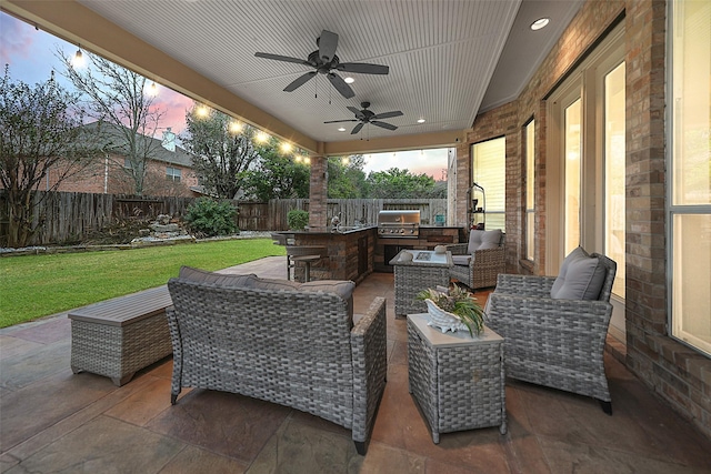 view of patio / terrace featuring a fenced backyard, ceiling fan, an outdoor living space, and area for grilling