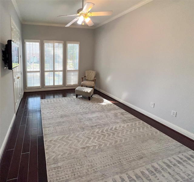 unfurnished room featuring baseboards, dark wood-type flooring, a ceiling fan, and crown molding