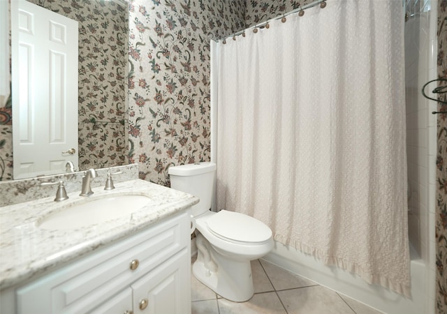 full bathroom featuring wallpapered walls, toilet, shower / tub combo, vanity, and tile patterned floors