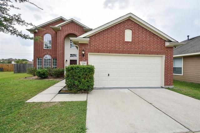 traditional home featuring concrete driveway, brick siding, and a front lawn