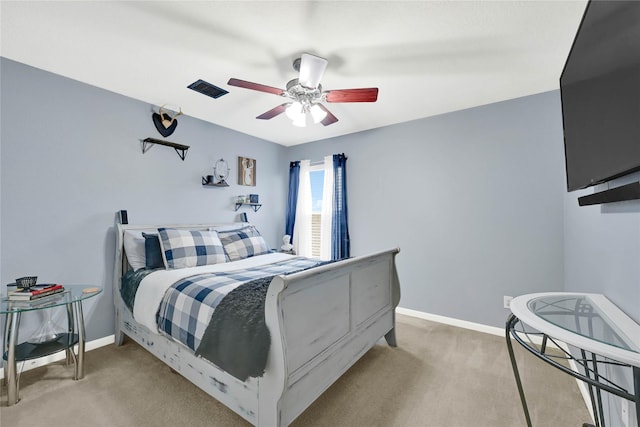 bedroom with baseboards, a ceiling fan, and light colored carpet