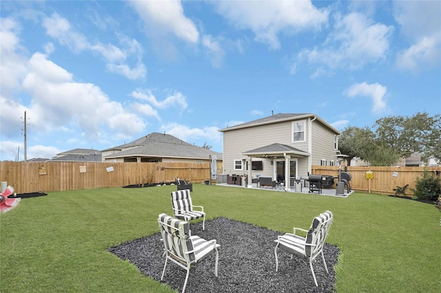 rear view of property with a patio area, a lawn, and a fenced backyard