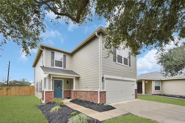 traditional-style house with brick siding, concrete driveway, fence, a garage, and a front lawn