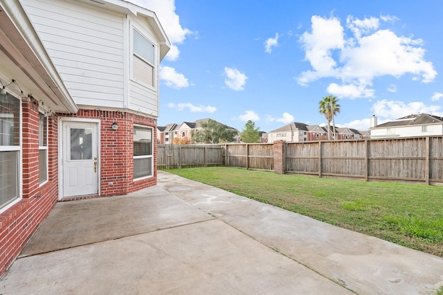 view of patio / terrace with a residential view and a fenced backyard