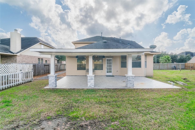 back of house featuring a patio, a lawn, a fenced backyard, and a ceiling fan