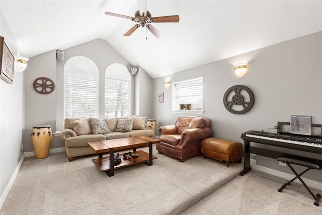 carpeted living room with lofted ceiling, ceiling fan, and baseboards