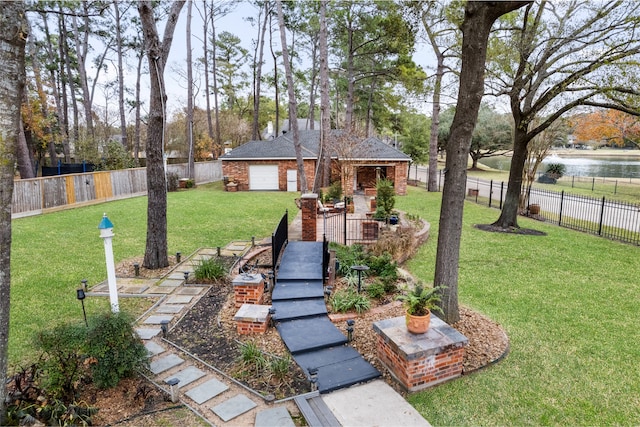 view of yard with a fenced backyard and an outdoor structure