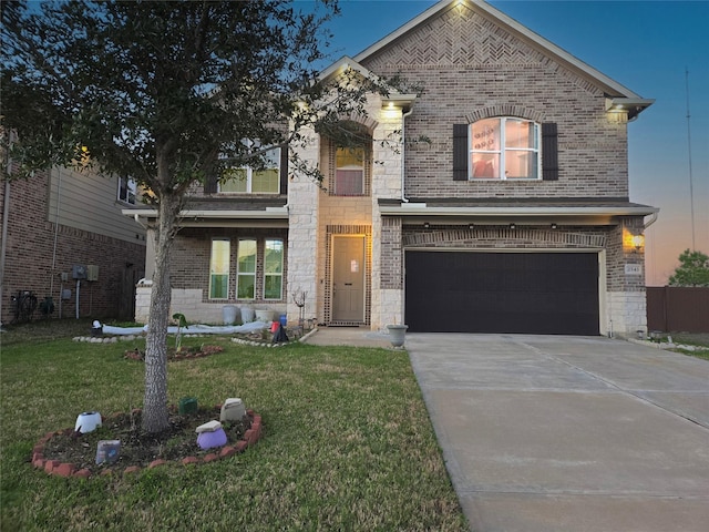 view of front of property featuring a front yard, stone siding, brick siding, and concrete driveway