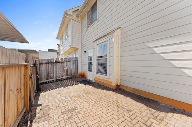 view of patio featuring fence