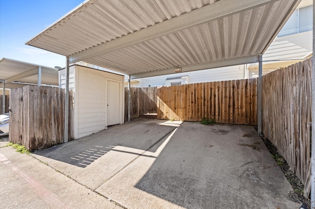 view of parking / parking lot featuring fence