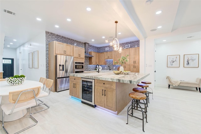 7517 Olympia Dr, Houston, TX 77063 - kitchen with beverage cooler, visible vents, stainless steel fridge with ice dispenser, a center island with sink, and pendant lighting