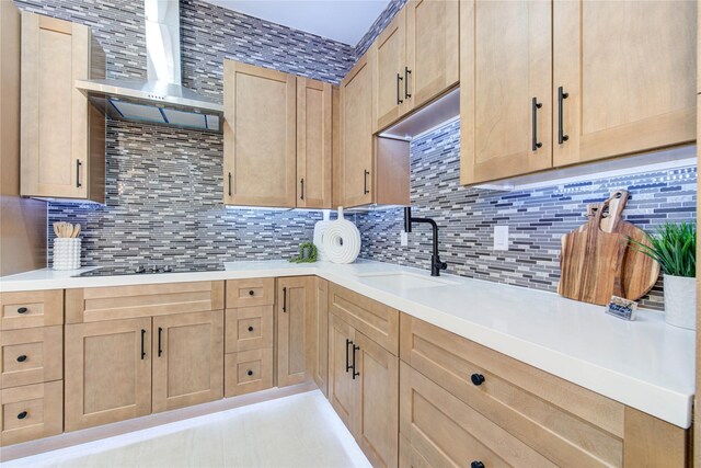 7517 Olympia Dr, Houston, TX 77063 - kitchen with wall chimney range hood, decorative backsplash, light countertops, and a sink