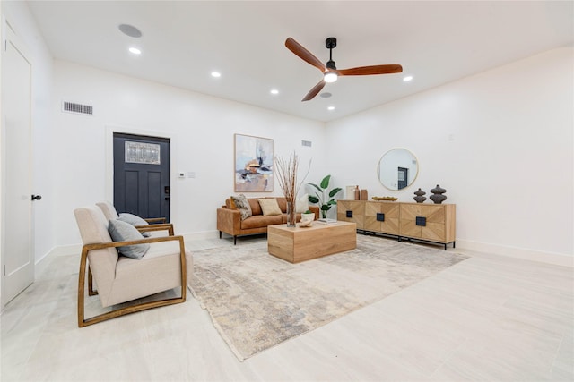 living room with baseboards, a ceiling fan, visible vents, and recessed lighting