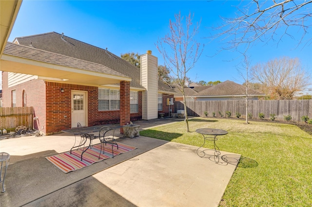 view of patio / terrace featuring fence